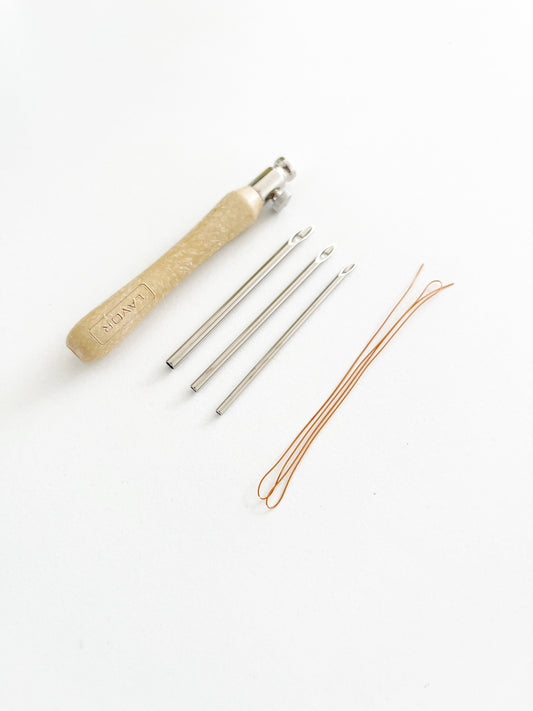 Punch needle adjustable with threader